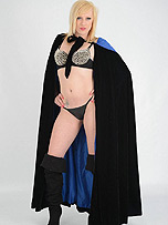Super girl Axajay is dressed up in a cloak with a tiny thong and gorgeous black boots